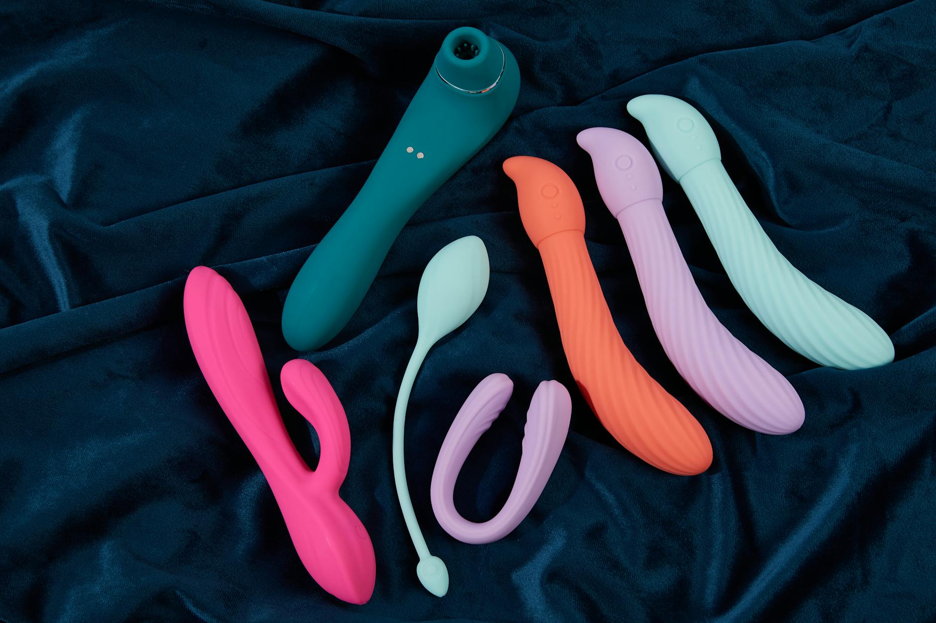 Woman holding lemon vibrators, contemplating sensation and pleasure